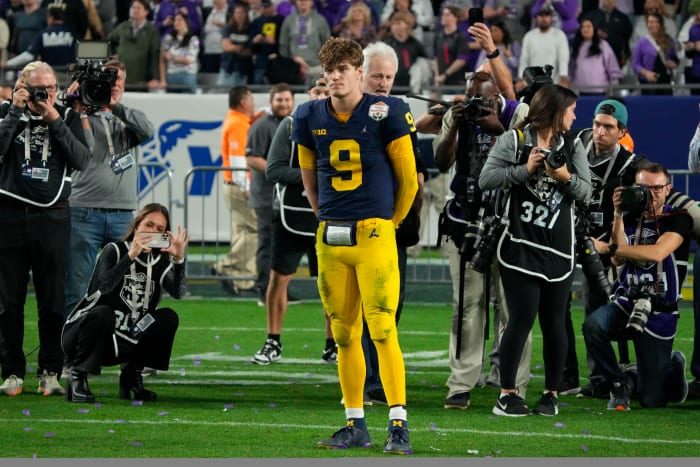 J.J. McCarthy watches TCU celebrate its win in the Fiesta Bowl.